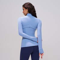 LIMVP OEM ODM Vêtements de yoga haut de gamme coupe ajustée couleur chair pour femme, moulant, respirant, en Spandex/Nylon, à manches longues, col montant, 220g