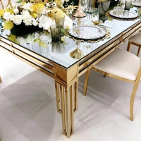 Table de salle à manger en acier inoxydable avec plateau en verre transparent, utilisée pour les tables de salle à manger d'hôtel et les réceptions de mariage