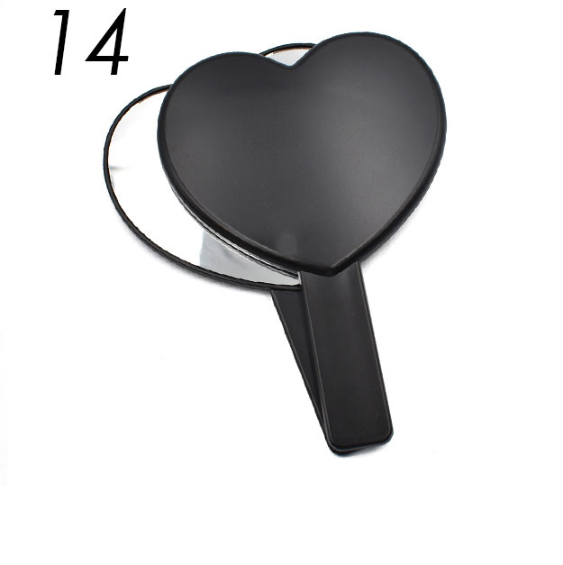 Black heart shaped handheld mirror