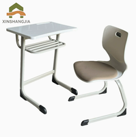 Ensemble table et chaise d'école réglables en hauteur avec bordure en mélamine, cadre en acier en forme de C et panier à livres pour salle de classe