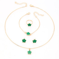 Ensemble de bijoux en alliage de trèfle porte-bonheur pour femmes 4 pièces collier bracelet anneau boucles d'oreilles cadeau de mode pour fête et usage quotidien