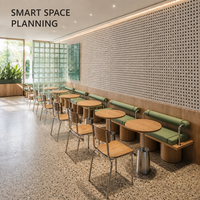 Ensemble de bancs vert sauge avec coussins et traverses, table ronde en bois avec chaises et tables sur piédestal pour restaurant, idéal pour café peu encombré