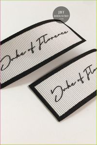 Factory wholesale prices on inexpensive woven neck tags sewn onto customizable fabric with your own logo. Fast shipping - Product Image 1
