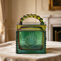 Pot en verre coloré en gros du fabricant avec couvercle, poignée perlée portable, motif coquille de tournesol européen, pot de rangement cosmétique pour la maison et les cadeaux