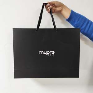 Bolsa de Regalo de Cartón Grueso KM para Ropa, Bolsa de Papel Negra de Marca Privada, Bolsa de Compras de Papel de Regalo de Lujo con Asa - Product Image 1