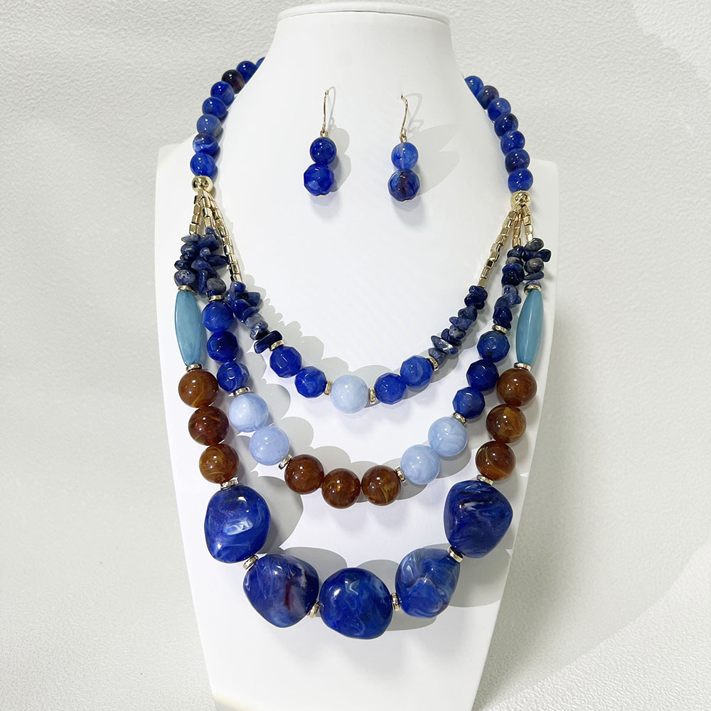Collana e orecchini a catena in acrilico bicolore blu