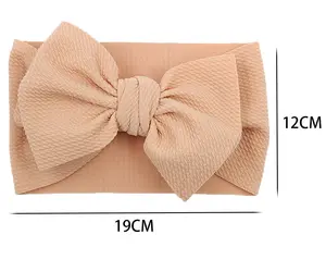 Bandeau élastique gaufré avec gros nœud pour enfants Bandeau enveloppant de couleur unie en coton Bandeau à nœud pour bébé pour enfants