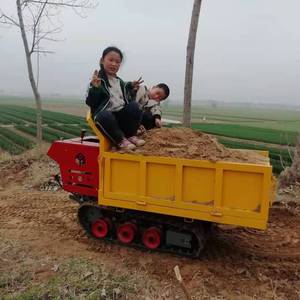 Transportador de orugas compacto con motor, amarillo, pequeño, para transporte de carga en uso agrícola y de construcción. - Product Image 1