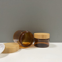 Bouteille en plastique pet givré ambré personnalisée de luxe 100ml 250ml 150ml 200ml pot de crème cosmétique pour le corps avec couvercles en bambou véritable