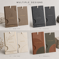 Étiquette de vêtement en papier multicouche personnalisée avec gaufrage à chaud et cordon pour l'image de marque des vêtements