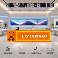 Comptoir d'accueil LED lumineux en forme de téléphone, design module caméra, comptoir personnalisé haute brillance pour magasin de téléphonie mobile et salle d'exposition technologique