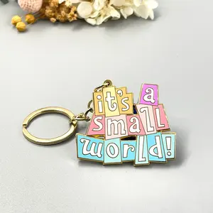 China Hot Products Metal custom crafts Personalized Cute a small world Pin Accessories Pendant Gold hard enamel keychains