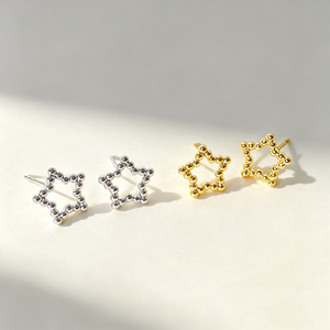 Boucles d'oreilles clous étoile creuses plaquées or 18 carats, design simple et tendance, en promotion - Product Image 1
