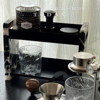 Étagère de rangement à deux niveaux en marbre noir naturel, design moderne, surface polie, construction durable pour cosmétiques et parfums de bureau