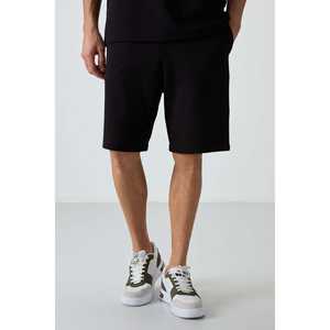 ชุดกางเกงขาสั้นผู้ชายทรงโอเวอร์ไซส์ผ้าฝ้ายสีดำ 100% ผ้าฝ้ายเนื้อพื้นฐาน รุ่น 85249 - Product Image 4