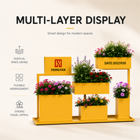 Support de présentation de plantes en métal jaune moderne et durable, résistant à l'eau, pour centre commercial, jardinières à plusieurs niveaux, logo personnalisé, mobilier d'extérieur