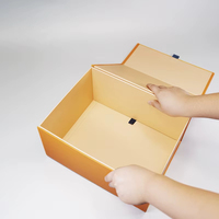 Scatola regalo pieghevole in cartone rigido a forma di libro nero di lusso con laminazione lucida scatola regalo magnetica a conchiglia personalizzata