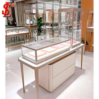 Comptoir de présentation de bijoux de luxe avec chaises de consultation, vitrine à bijoux haut de gamme à LED pour l'aménagement de boutiques