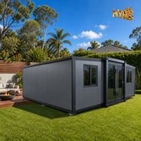 Maison Modulaire 20 pieds à Double Aile Extensible, Conteneur Habitable avec Cadre Noir et Panneaux Gris Fer pour Bureau et Studio