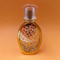 Flacon de parfum rond en verre doré de luxe de haute qualité 50 ml avec diffuseur à bâtonnets, bouchon à vis, gravure et sérigraphie, livraison rapide