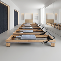 Cadillac Reformer Pilates en alliage d'aluminium durable avec rail complet, emballage en boîte en bois de chêne, pour studio de Pilates et fitness