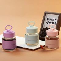 Bouteille d'eau en verre de 300 ml avec couvercle créatif intégrant un support pour téléphone et manchon en cuir isolant, mini-gobelet à lait portable