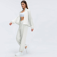 Veste coupe-vent respirante à col montant pour femme Ourlet réglable Vêtement de sport pour le vélo, la course à pied et le yoga Haut zippé avec poches