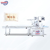 Machine d'emballage entièrement automatique pour aliments surgelés, type coussin, pour barquettes alimentaires et pains vapeur