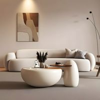 Table basse de salon durable au design unique et contemporain, cadre rond en bois blanc avec plateau en verre