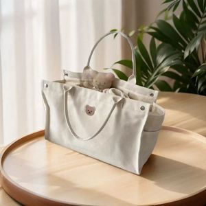 Wholesale Organizer Tote <b>Bag</b> for Diaper Nappy and Daily Essentials Multi Pocket Handbag Messenger <b>Bags</b> <b>Canvas</b> - Product Image 1