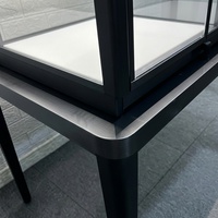 Comptoir de présentation de bijoux de luxe en acier inoxydable noir avec dessus en verre, éclairage LED, vitrine d'exposition verrouillable pour montres