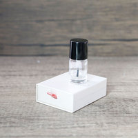 Bouteille d'huile pour cuticules de forme ronde transparente personnalisée de 15ml bouteille vide de vernis à ongles pour huile pour cuticules avec capuchon noir et brosse