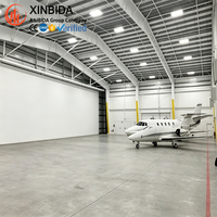Hangar préfabriqué en acier à grande portée pour le stationnement d'avions, atelier, structure stable, installation rapide sur site