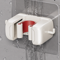 Support mural contemporain gris et blanc moulé par injection pour balai et serpillière, crochet mobile sans perçage pour rangement de salle de bain et toilettes