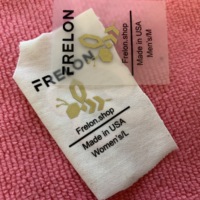 Étiquettes d'entretien de vêtements par transfert de chaleur sans étiquette PET imprimées avec logo personnalisé, autocollant par transfert de chaleur pour produit de Offre Spéciale de vêtement