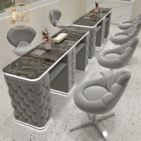 Ensemble de table et chaise de manucure de luxe avec plateau en marbre capitonné à bulles, éclairage LED et tiroirs pour salon de beauté