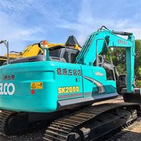 Excavatrice hydraulique sur chenilles d'occasion de 20 tonnes, de fabrication japonaise, Kobelco SK200D, pour démolition et travaux de renforcement.