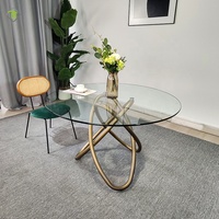 Ensemble table et chaises de salle à manger en ardoise moderne Table de salle à manger ronde en verre transparent à structure en métal doré de luxe