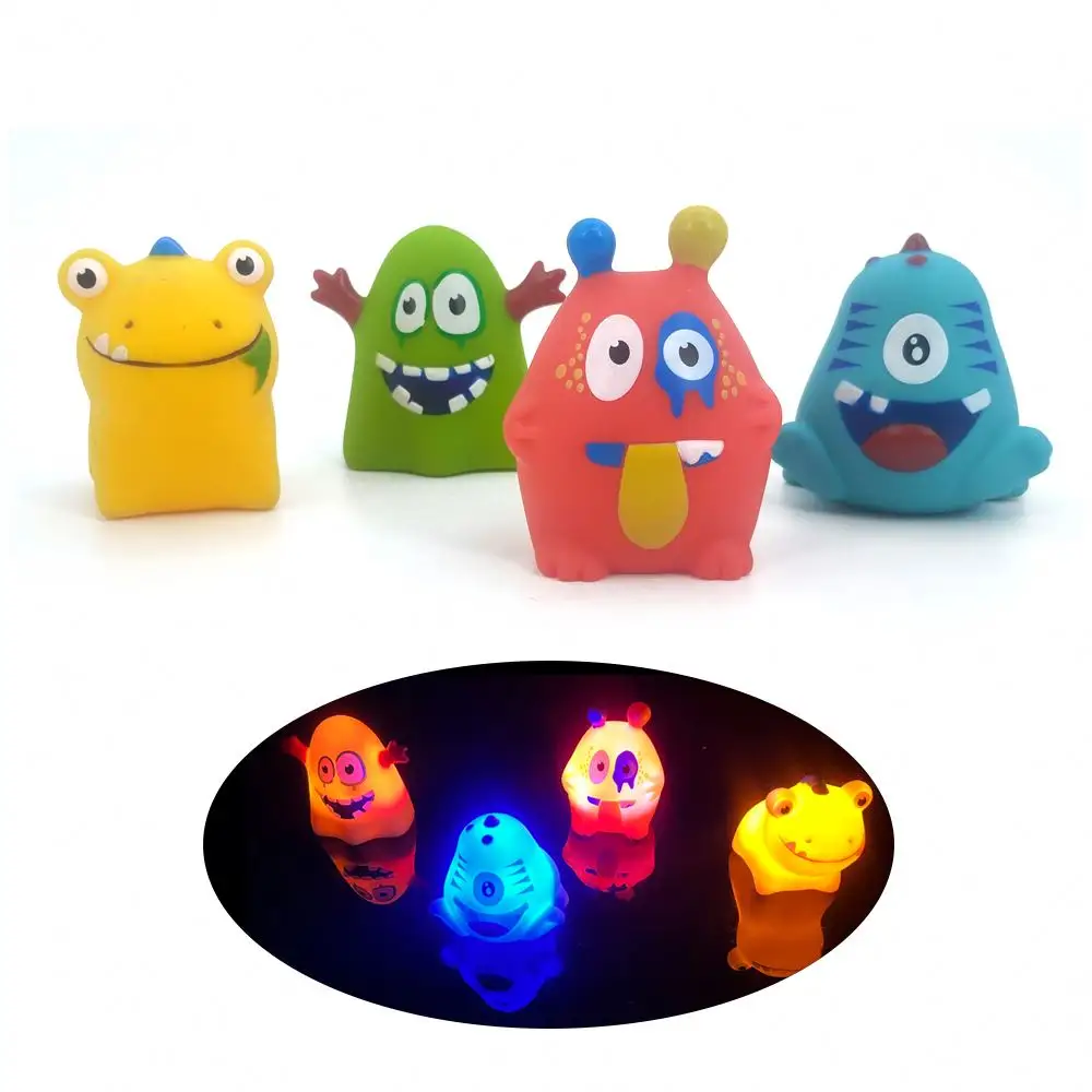JiXing OEM Silikon Badewanne Spielzeug Floating PVC Gummi Monster Bades pielzeug mit Leucht für Kinder