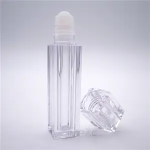 フレグランスオイルローラーボトルに四角い透明な空の香水オイルボトルが転がる