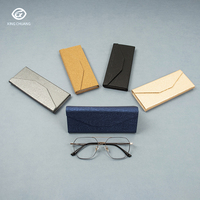 Alibaba Meilleure vente boîte à lunettes en cuir Logo personnalisé étui à lunettes pliant Triangle étuis à lunettes étuis à lunettes en gros