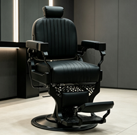 Fauteuil de barbier vintage en cuir cousu avec cadre noir mat, fauteuil de salon hydraulique pour usage professionnel en salon de coiffure