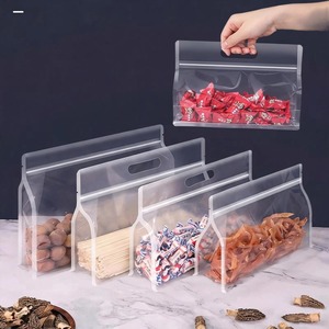 Customized Clear Bopp Pillow <b>Bags</b> <b>Snack</b> Candy Packaging Reusable Food Grade Stand Up Zip Lock Packaging Pouch <b>Bag</b> Handle - Product Image 1