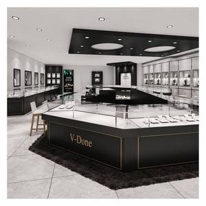 Agencement Intérieur Complet de Bijouterie Moderne Noir et Or : Comptoir Central en Verre Personnalisé et Vitrine Murale pour Présentation de Bijoux - Product Image 1