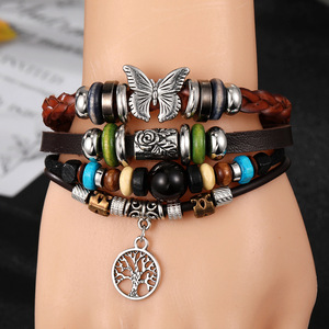 สร้อยข้อมือหนังหลากสีลายปีกผีเสื้อ ต้นไม้แห่งชีวิต ใบไม้ ตาปีศาจ เครื่องรางนำโชค สำหรับเด็กชาย เด็กหญิง สร้อยข้อมือหนังเท่ๆ ของขวัญสำหรับนักเรียน - Product Image 1