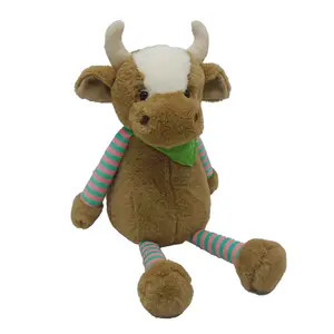 Poupée de vache en peluche marron avec écharpe triangulaire verte