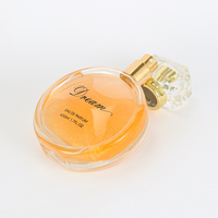 Damenparfüm in Kugelförmigem Glasflakon mit Bernsteinfarbener Flüssigkeit, Goldener Verschluss, Strahlender Bronze-Verpackung, Fantasievolle Geburtstags-Edition mit Langanhaltender Duftnote