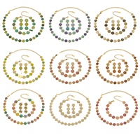 Parure de bijoux pour femme en acier inoxydable plaqué or 18 carats avec boucles d'oreilles pendantes, bracelet et collier trèfle en zircon