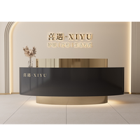 Bureau de réception de salon de beauté de forme ovale au design de luxe avec Led Bureau de réception moderne en acier inoxydable noir blanc pour le bureau