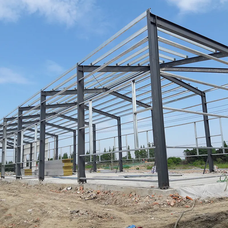 Construction en usine entrepôt léger préfabriqué modulaire cadre en acier bâtiment métallique préfabriqué lumières de scène éclairage d'entrepôt GB